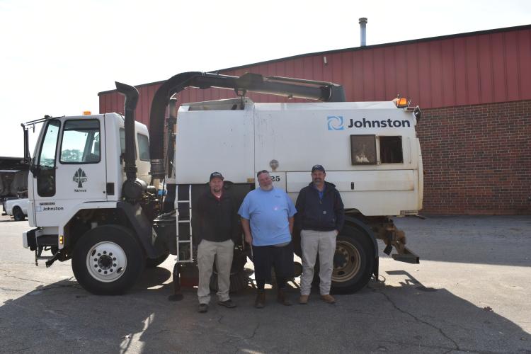 City of Hickory staff Dan, Bobby, and John in front of Johnston VT650 street sweeper